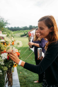 Glamping Launch Party Canned Sangria -045 pick your own flowers person lifestyle