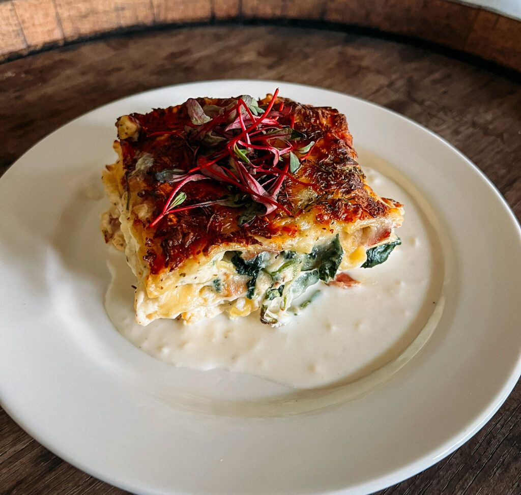 Lasagna Bianco - ricotta, mozzarella, parmigiano reggiano, spinach, prosciutto, fresh herbs