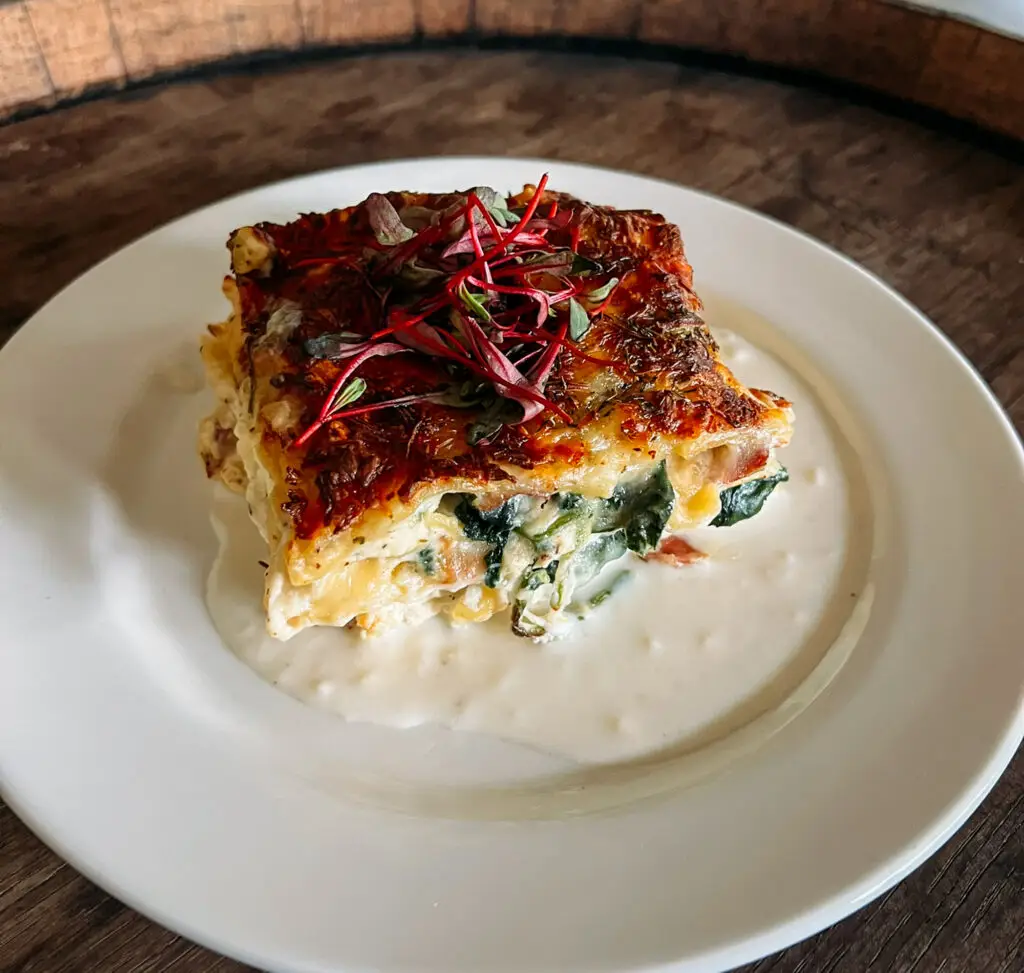 Lasagna Bianco - ricotta, mozzarella, parmigiano reggiano, spinach, prosciutto, fresh herbs